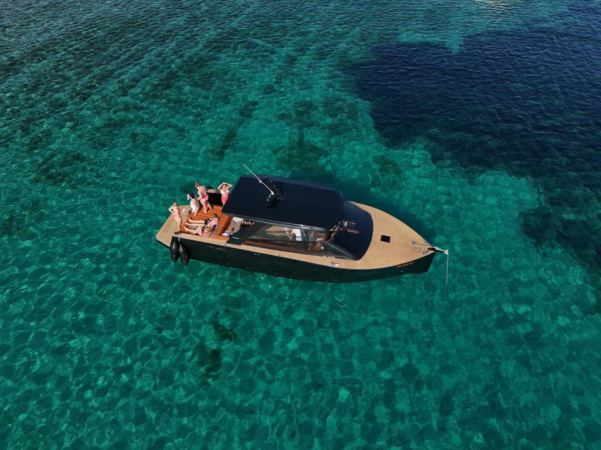 Full group on deck in turquoise Adriatic water