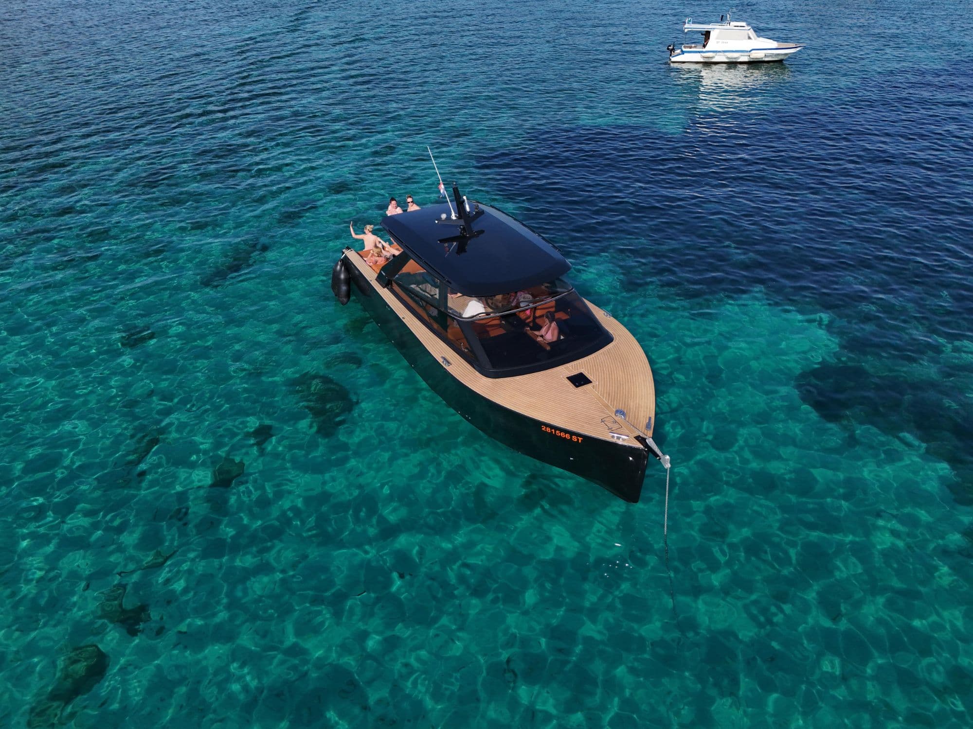 Colnago 35 floating in turquoise water from the air