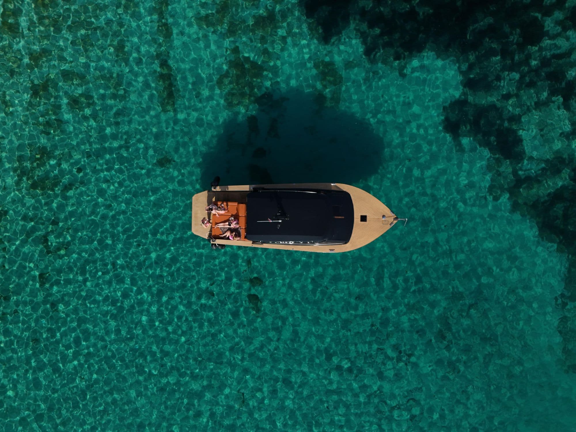 Colnago 35 anchored in crystal-clear turquoise water, Pakleni Islands