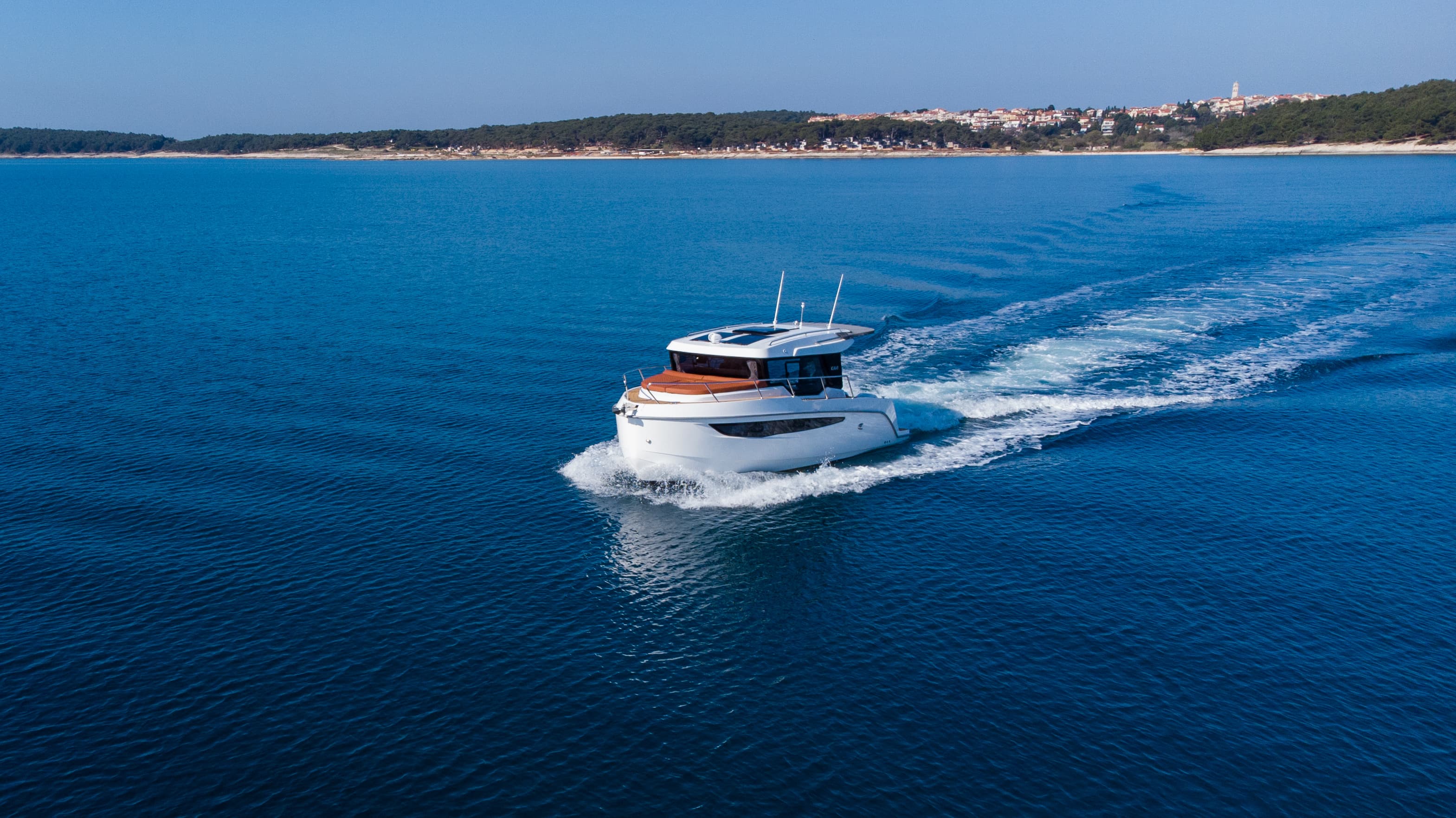Private motor yacht at speed across the Adriatic near Split