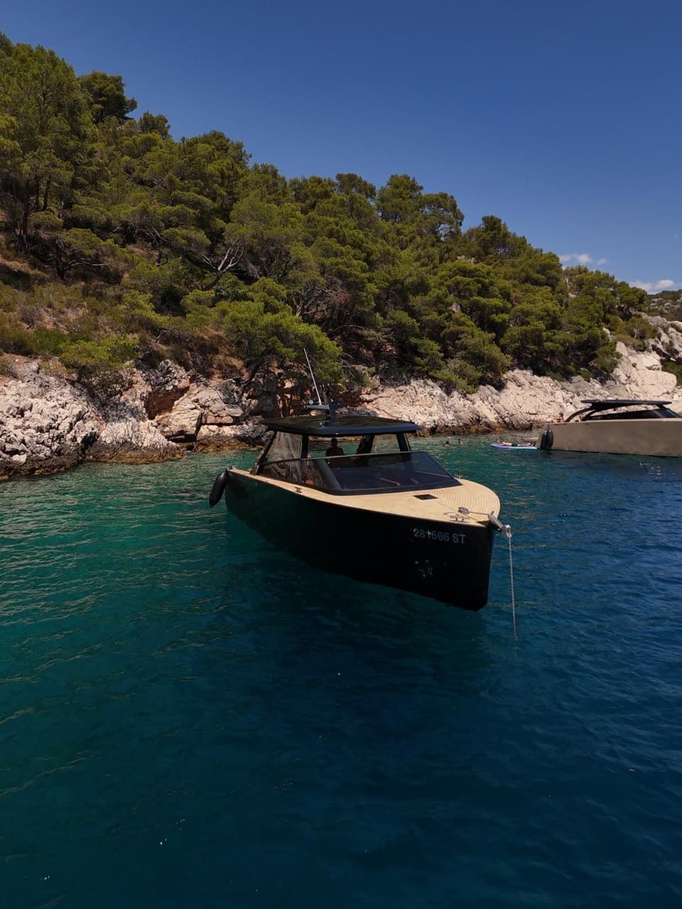 The Colnago 35 floating over pale turquoise shallows near Split