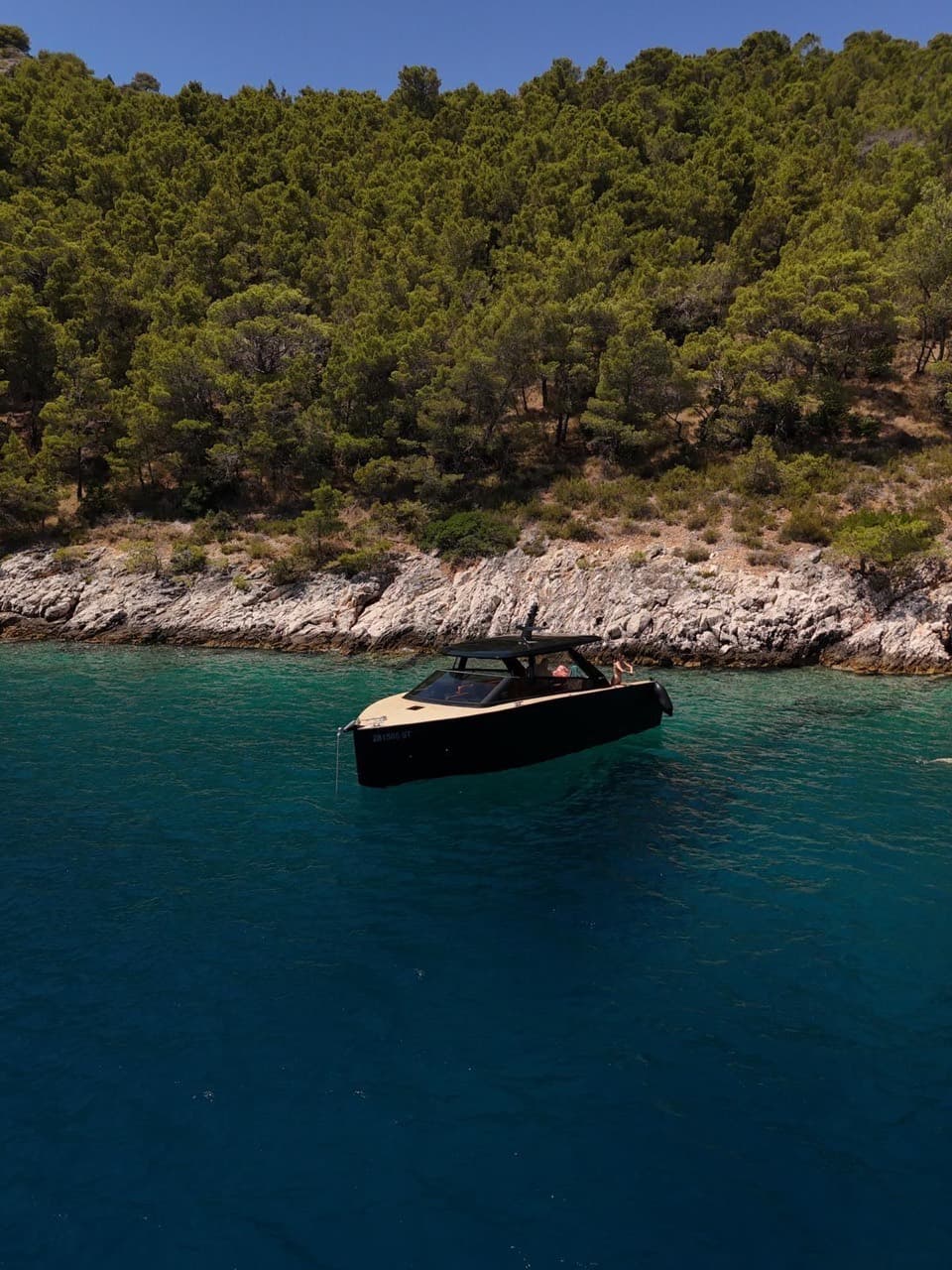 Colnago 35 moored close to a pine-and-rock coastline near Split