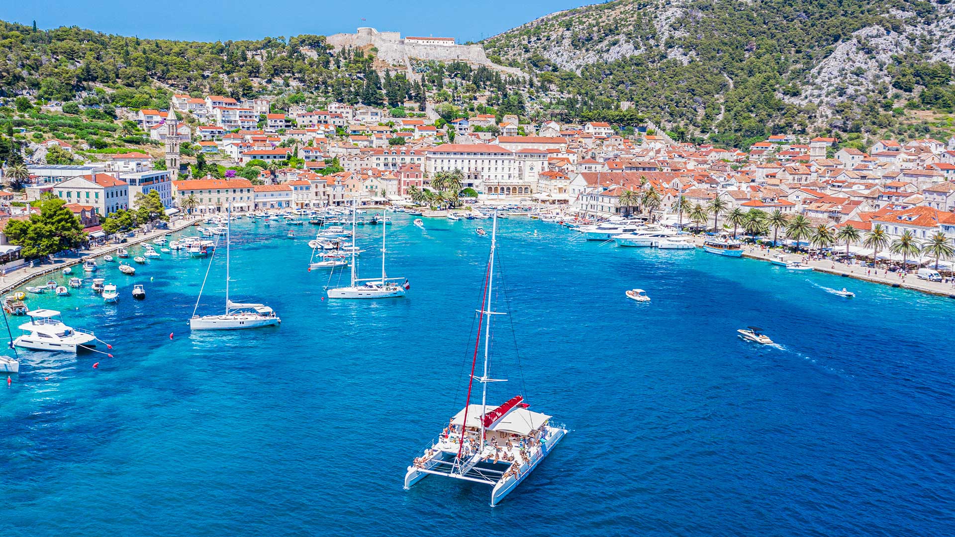 Hvar harbour seen from the water on a sunny afternoon